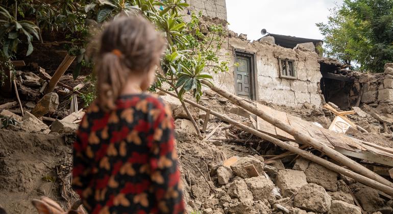 A six-year-old girl looks at the ruins of her home, destroyed in the 31 August earthquake in eastern Afghanistan.